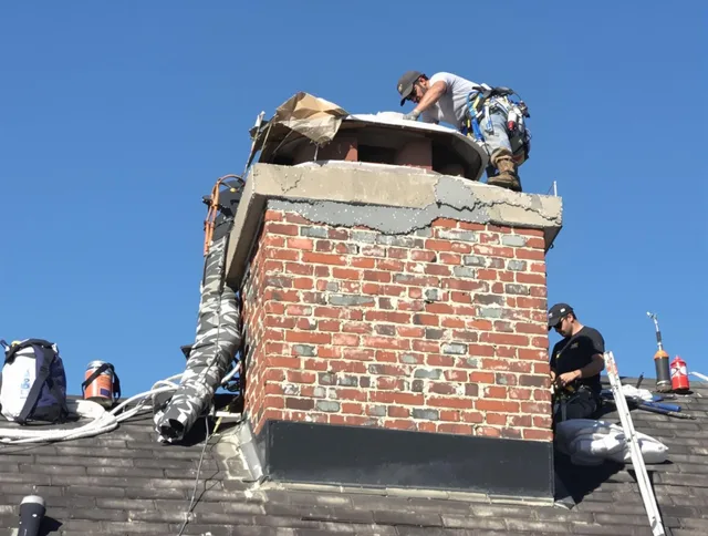 Rincon Chimney Sweep installing a custom chimney crown in Rincon, GA